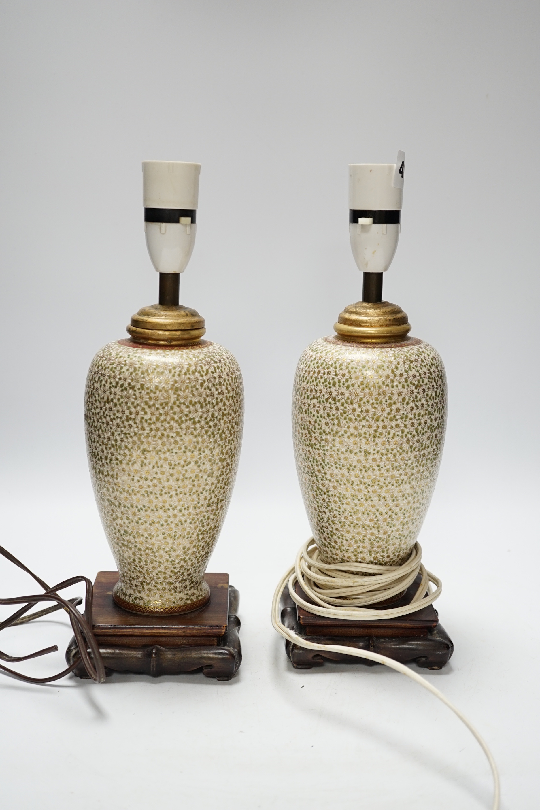 A pair of Japanese Satsuma vases mounted as lamps, total height including lamp fittings 31.5cm